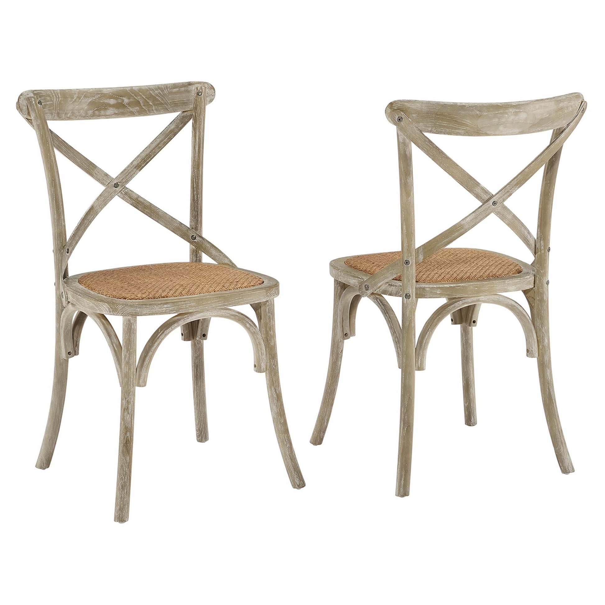 Pair of weathered gray wooden chairs with X-back and woven cane seats, rustic dining set.