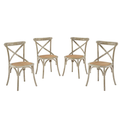 Four gray distressed cross-back dining chairs with woven cane seats, rustic vintage style.