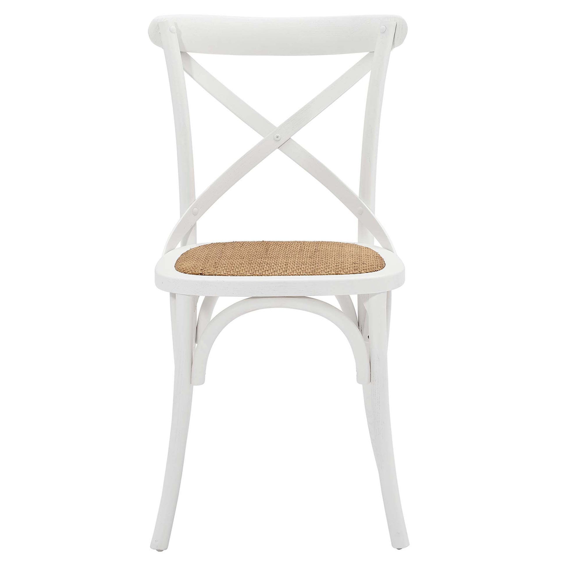 White dining chair with an X-back and a woven seat.