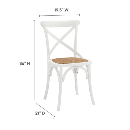 White wooden cross-back dining chair with a woven cane seat; 19.5"W x 36"H x 21"D, for dining.