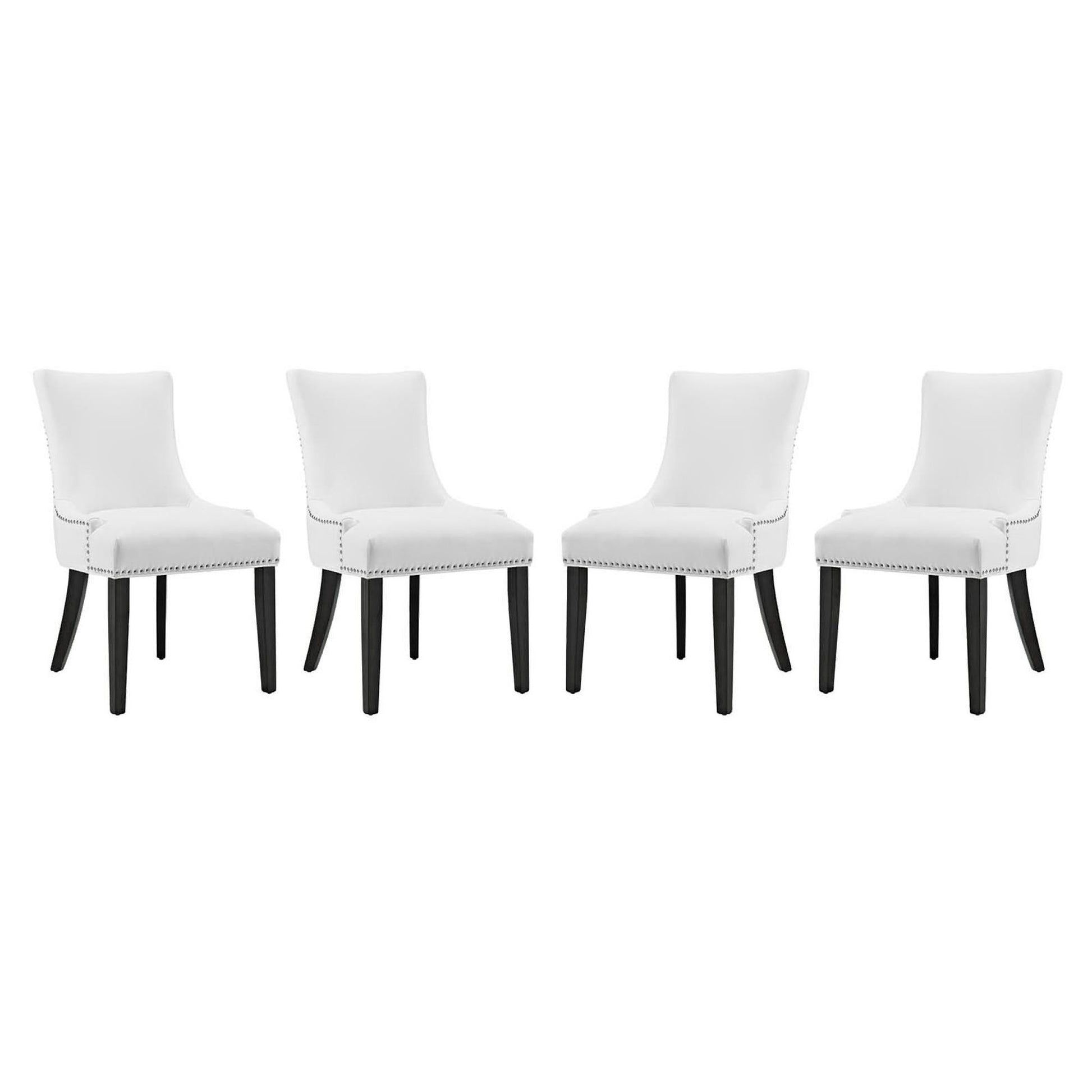 Set of four white faux leather dining chairs with dark tapered legs and nailhead trim.