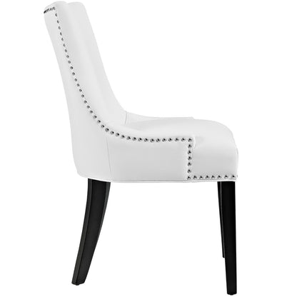 White faux leather dining chair with nailhead trim, curved back and padded seat, black legs.