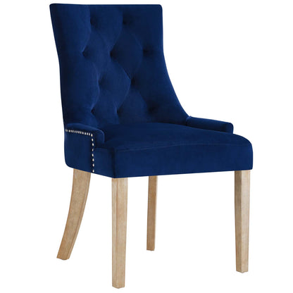 Navy blue velvet tufted dining chairs with nailhead trim and light wood legs, set of 2.