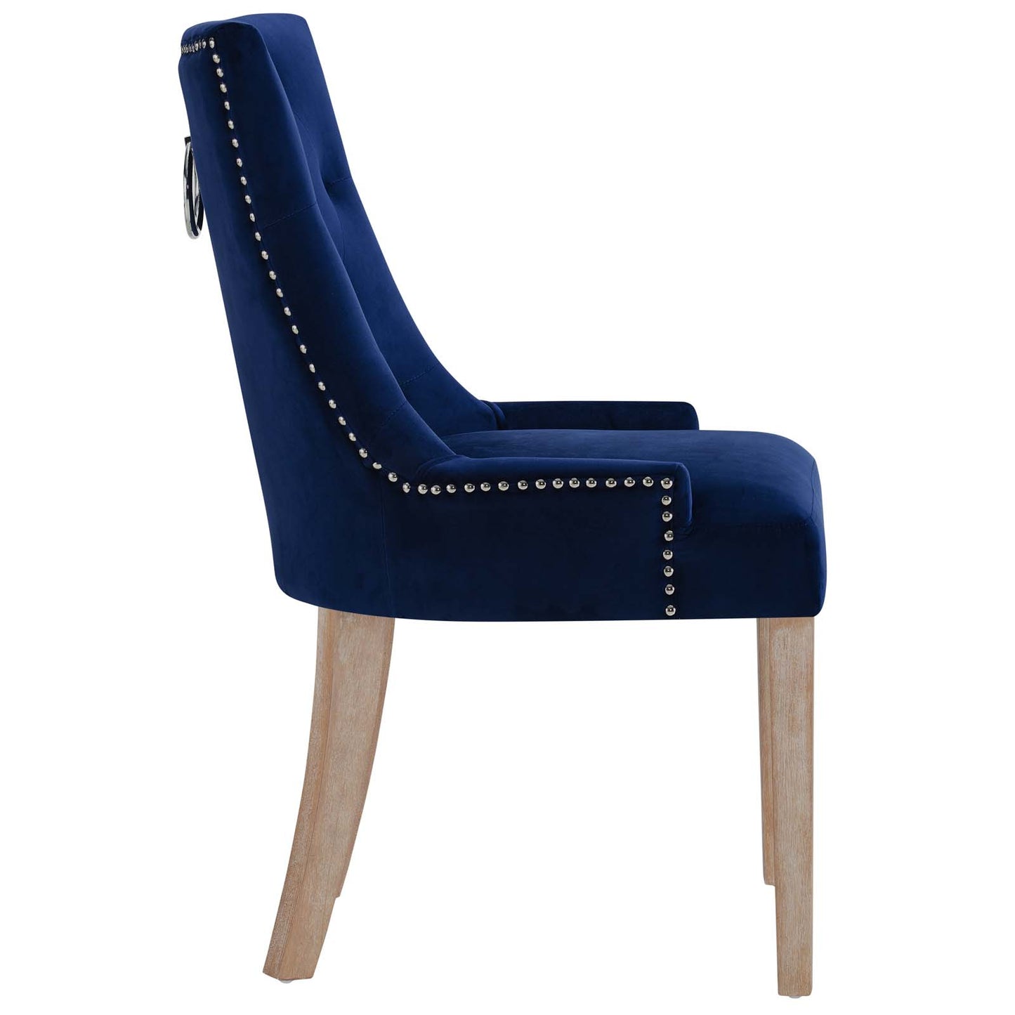 Two navy blue velvet dining chairs with silver nailhead trim along the edges, curved backs, and light wood legs.