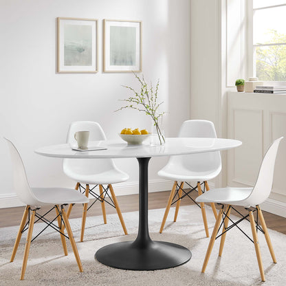 White oval wood dining table with a black pedestal, surrounded by white molded chairs with wooden legs; modern dining set.