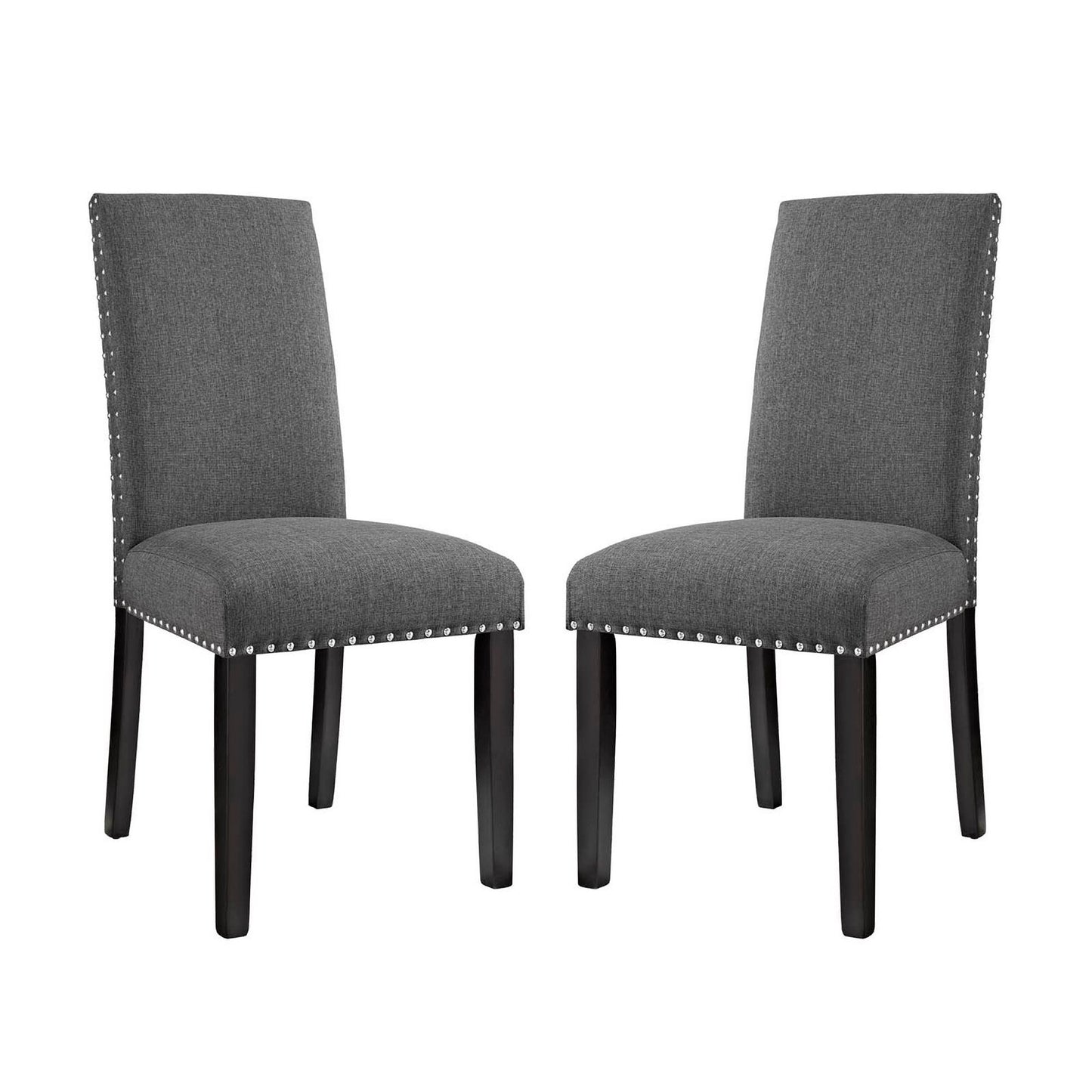 Pair of gray upholstered dining chairs with tall backs, dark wood legs, and silver nailhead trim.