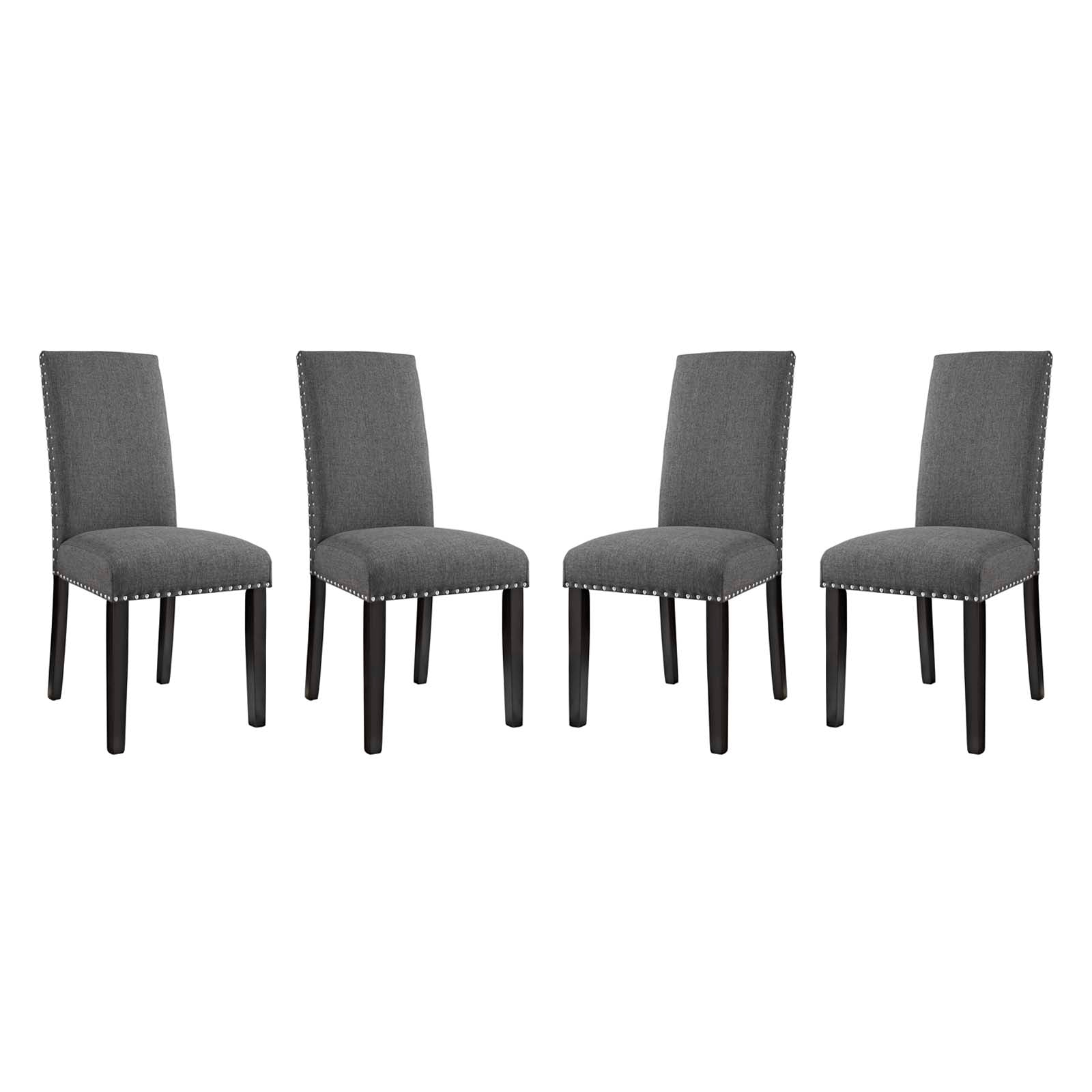 Set of four grey upholstered dining chairs with nailhead trim & dark wood legs.
