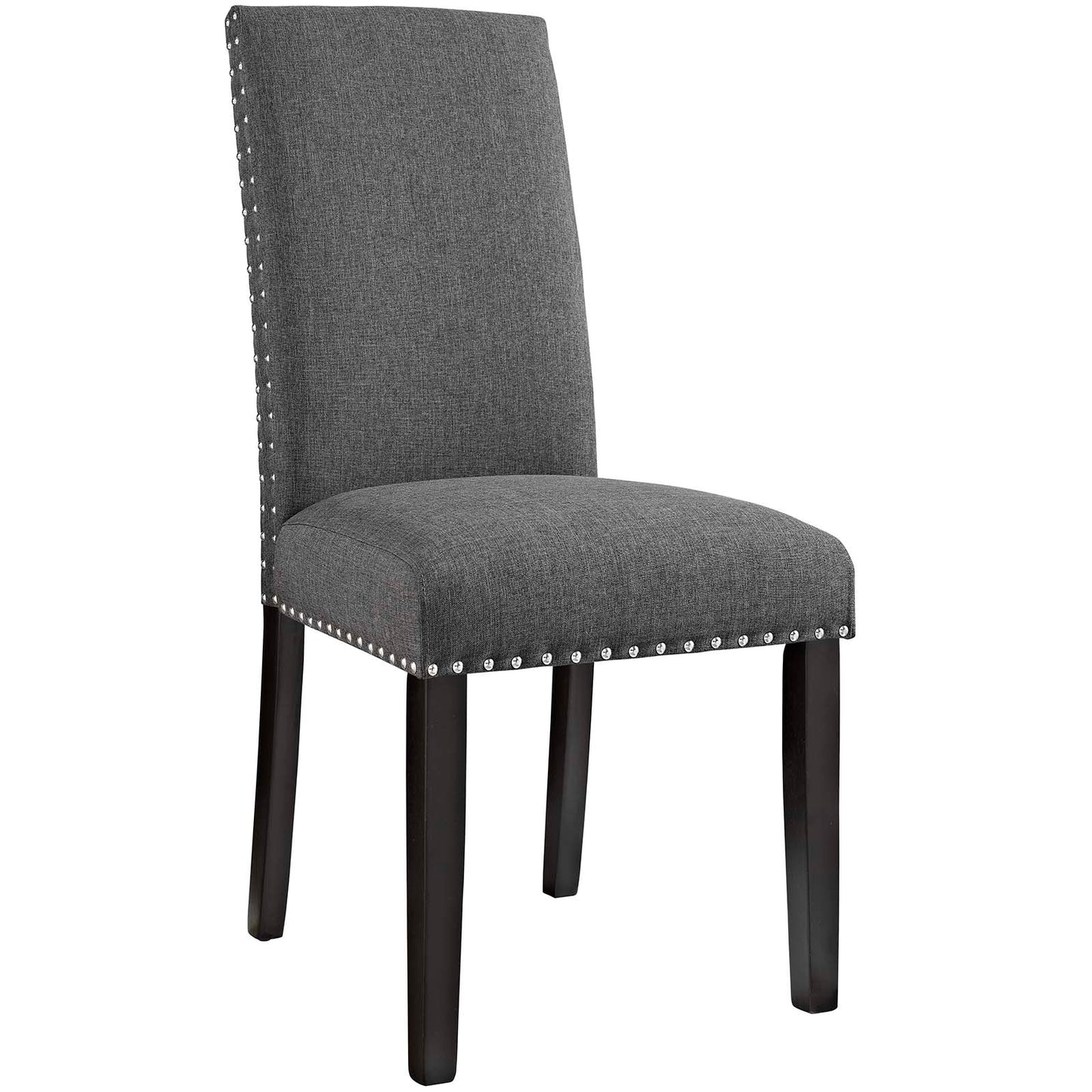 Grey fabric dining side chair with tall back, dark wood legs, and silver nailhead trim along seat and back edges.