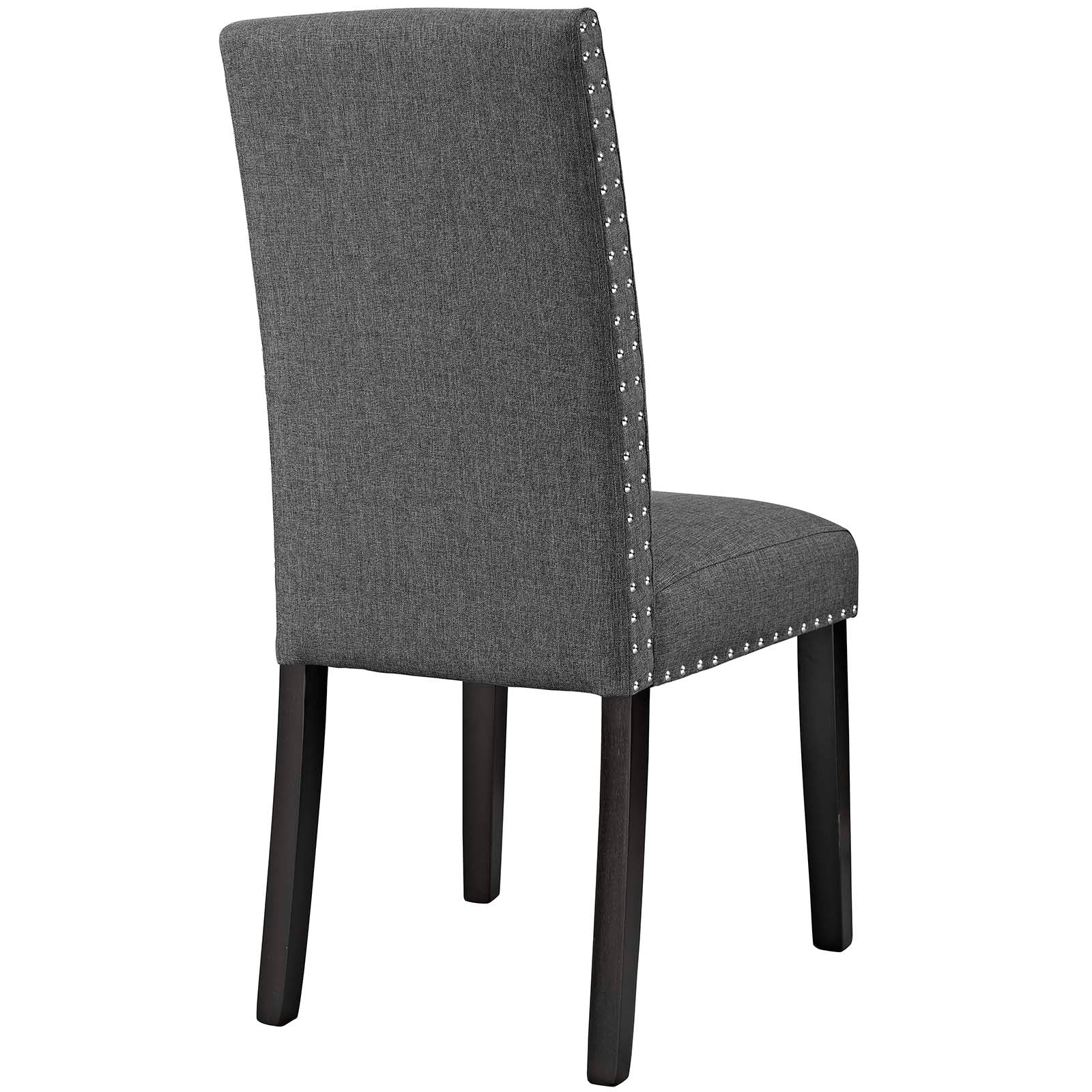 Gray upholstered dining side chair with high back, nailhead trim, and dark wood legs.