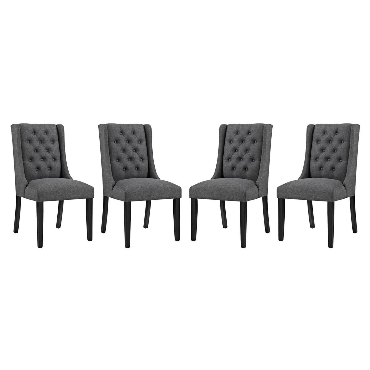 Set of four gray tufted dining chairs with fabric upholstery and tapered black legs.