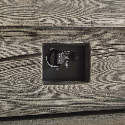 Rectangular outdoor fire pit table in light gray with a black control panel featuring ignition dial and push button.