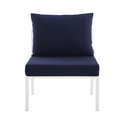 White aluminum armless outdoor patio chair with navy seat and back cushions.