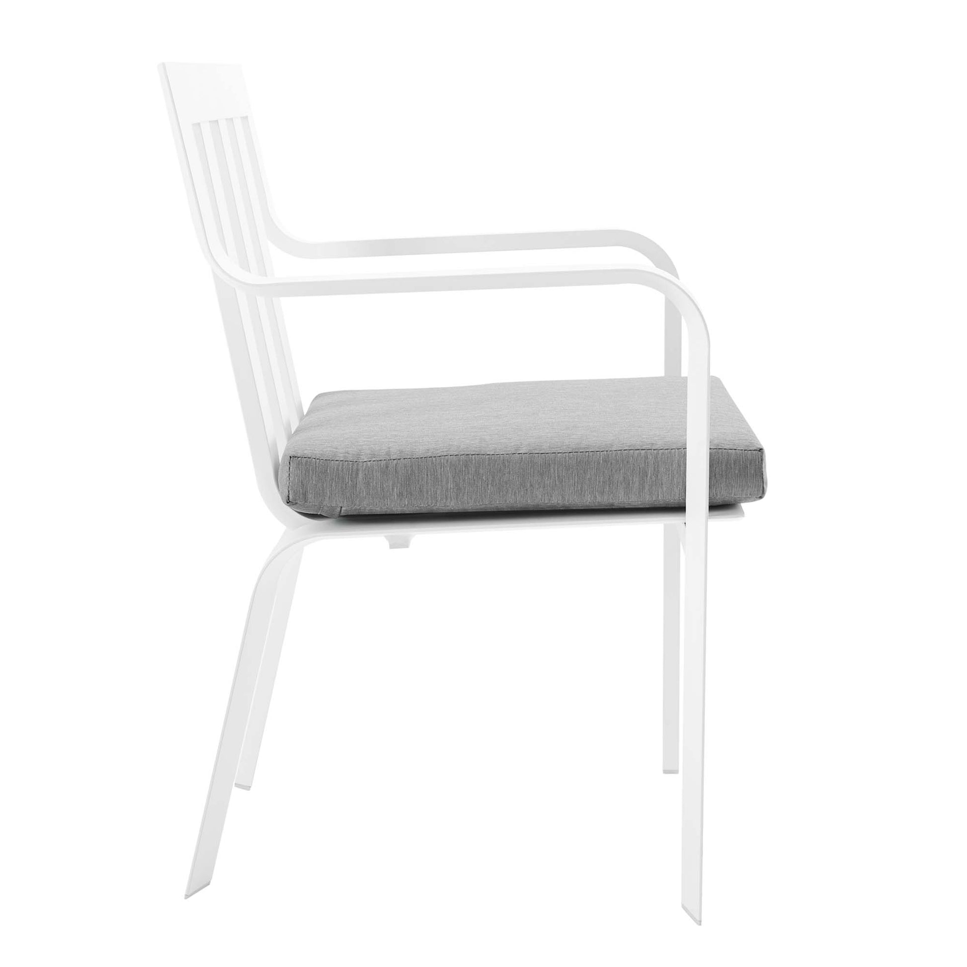 White aluminum outdoor dining armchair with a grey cushion, slatted back and curved armrests.