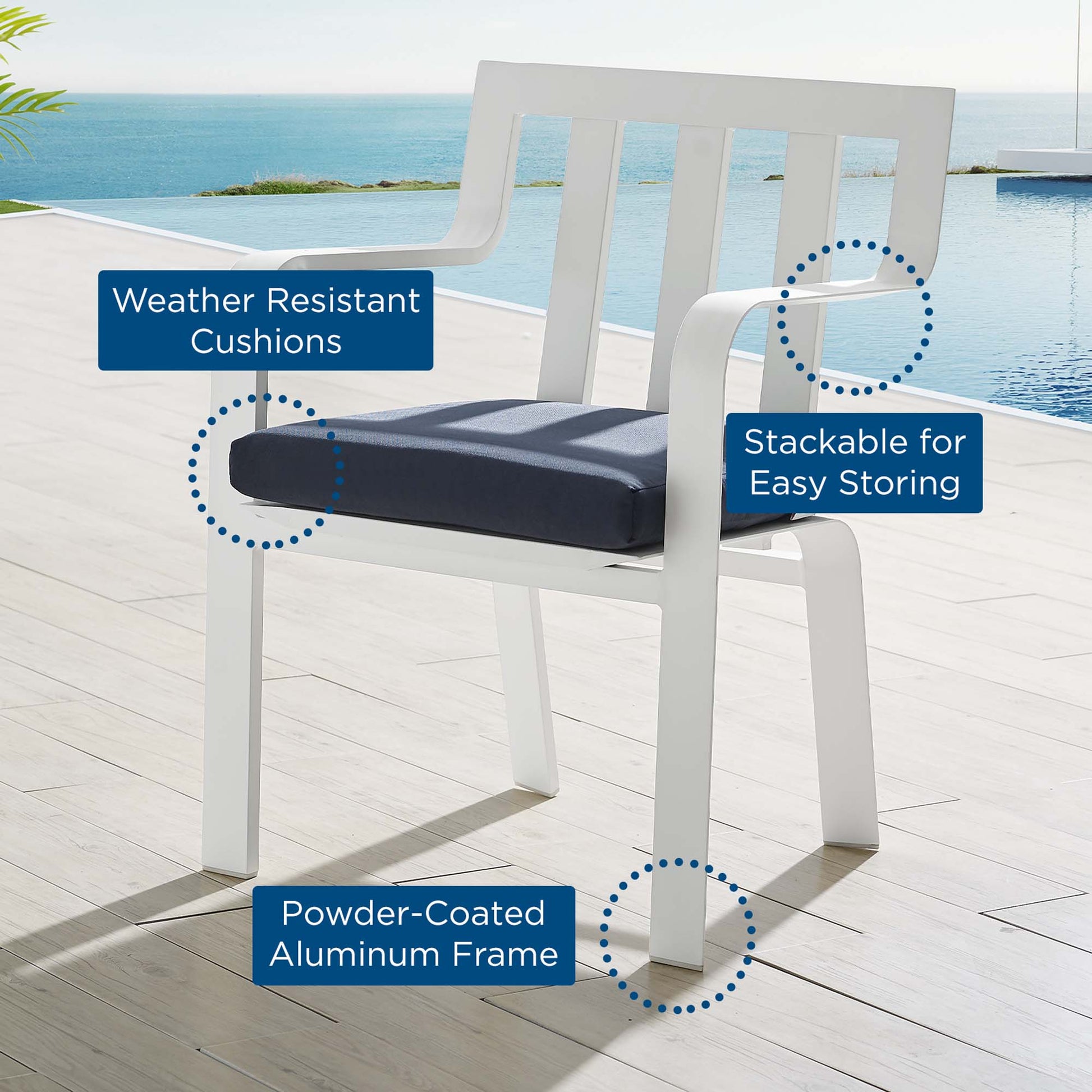 White powder-coated aluminum outdoor patio dining armchair with a navy cushion; stackable for easy storage beside a pool.