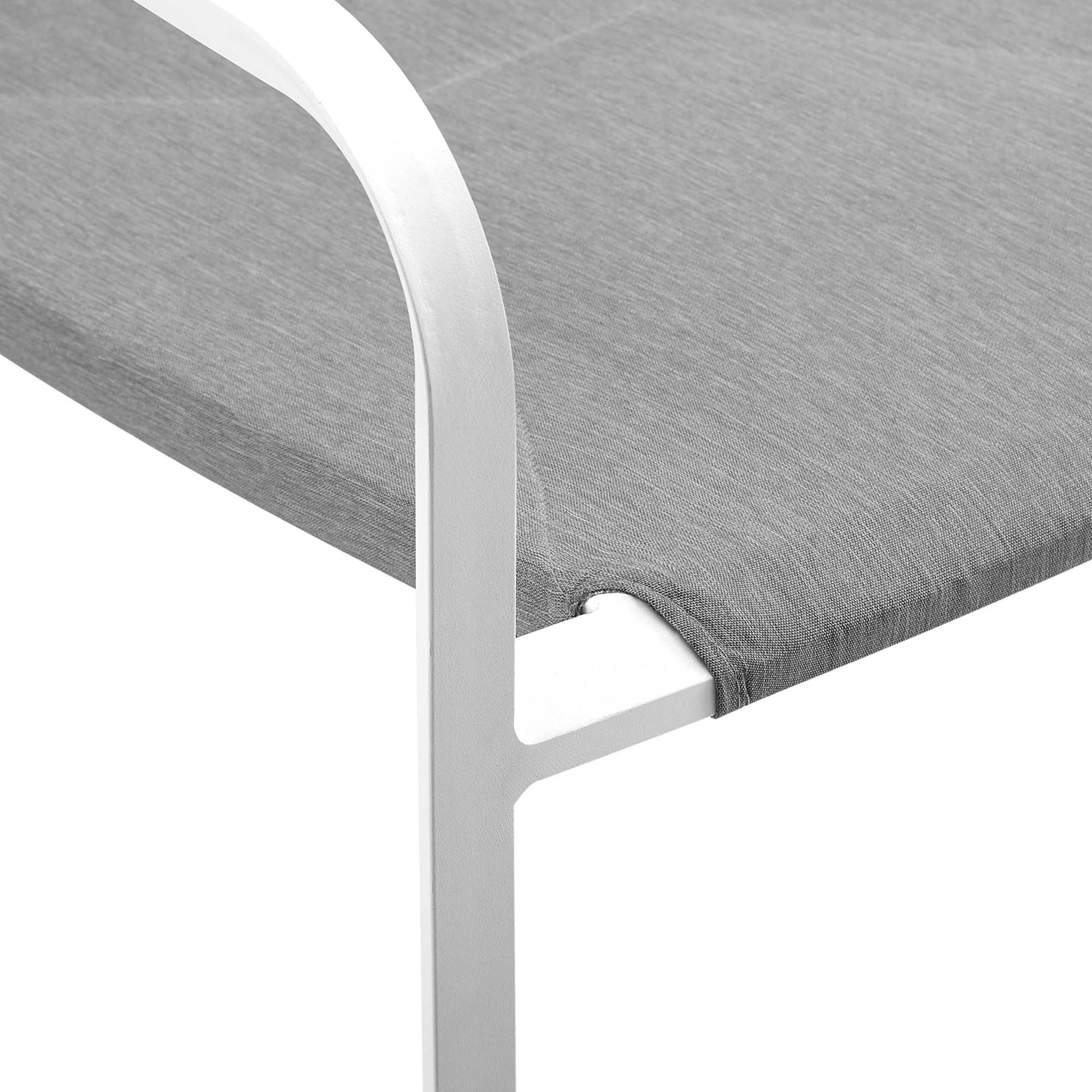 White aluminum-frame outdoor stackable dining armchair with gray seat and curved arm.