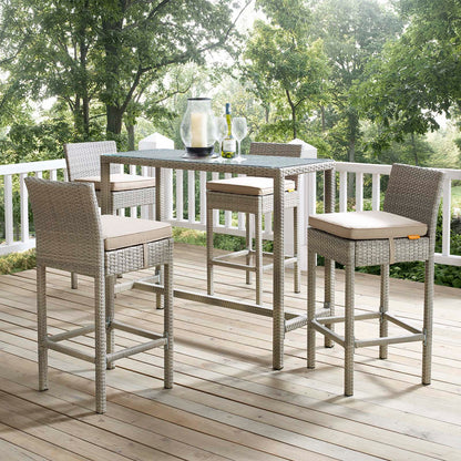 Light gray beige wicker outdoor bar-height stools with beige cushions; set of 4.