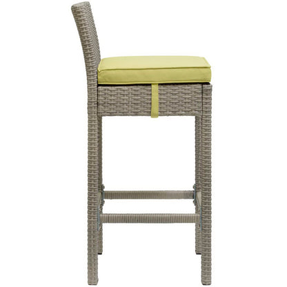Set of 4 gray synthetic rattan outdoor bar stools with high backs, lime-yellow cushions, and built-in footrests.
