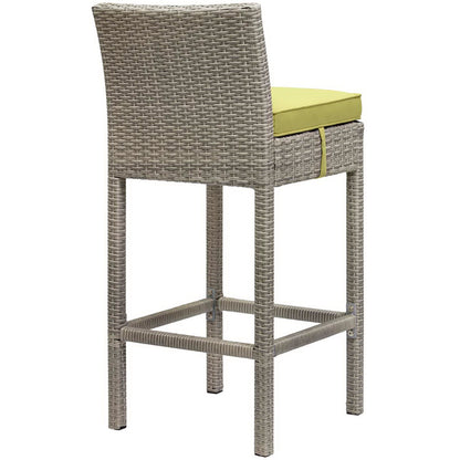 Gray woven rattan bar stools with lime-green cushions, high backs, and footrests for outdoor patio; set of 4.