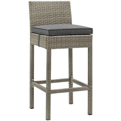 Outdoor light-gray wicker bar stools with backrests and gray cushions; counter-height seating with footrests.
