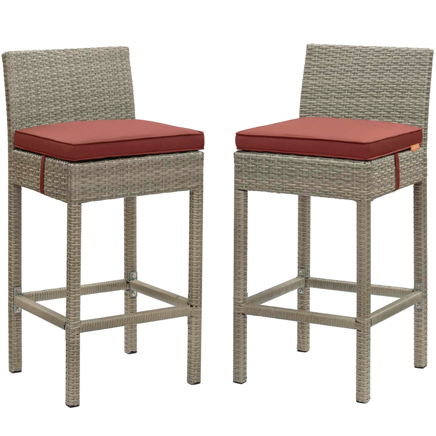 Pair of tall gray wicker bar stools with red cushions and footrests for outdoor patio use.
