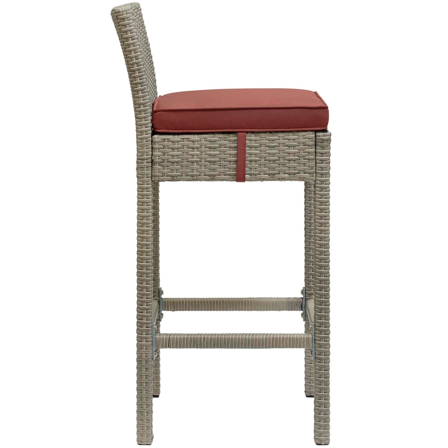 Tall light gray wicker bar stool with red cushioned seat, woven back, & built-in footrest.