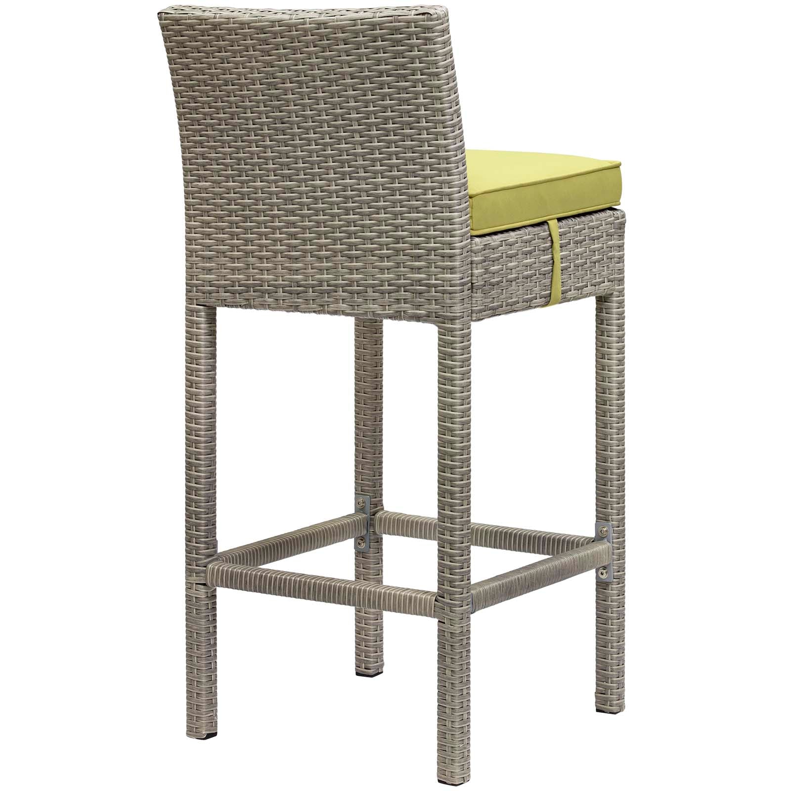Tall gray wicker bar stools with lime-green cushions, square woven legs & footrests for outdoor patio.