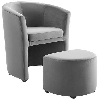 Grey velvet curved-arm chair with matching round ottoman; modern lounge set for living room.