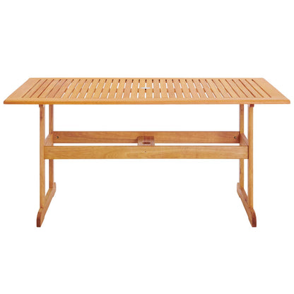 Natural wood slatted top dining table with trestle legs for outdoor patio use.