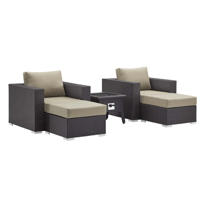Dark brown wicker outdoor lounge set with beige cushions: two armchairs, a matching ottoman, and a fire pit coffee table.