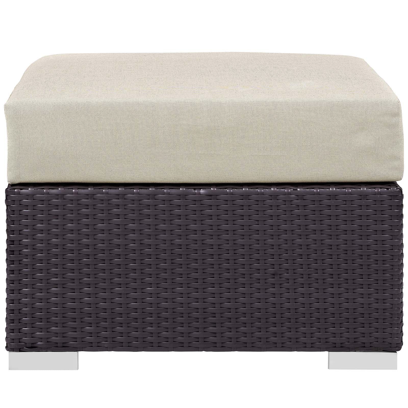 Dark brown woven wicker outdoor patio seating piece with a beige cushion & metal feet, part of a 5-piece set with a fire pit.