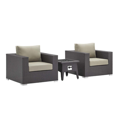Dark brown wicker outdoor seating set with beige cushions; two square armchairs & a matching fire pit table.