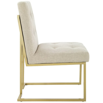 Beige tufted upholstered dining chair with gold stainless steel frame, side view.