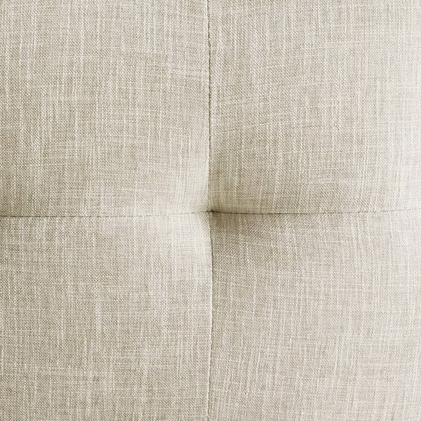 Gold-beige linen-look upholstery fabric close-up on the seat cushion of a stainless steel dining chair, showing woven texture and seam details.