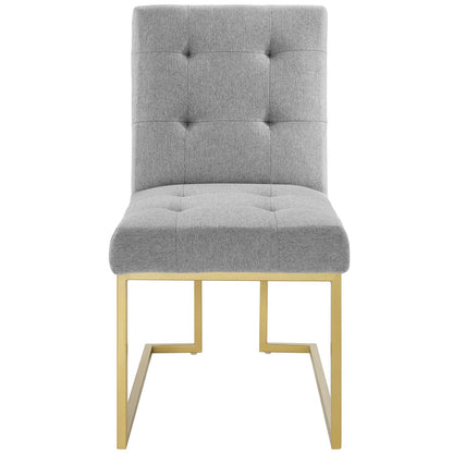 Light gray tufted dining chair with gold stainless steel legs forming a square frame.