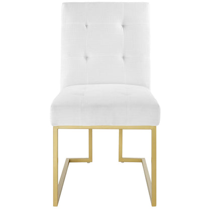 White tufted upholstered fabric dining chair with a gold stainless steel angular frame.