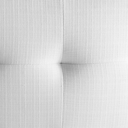 White tufted fabric upholstery close-up with textured weave and subtle vertical lines.