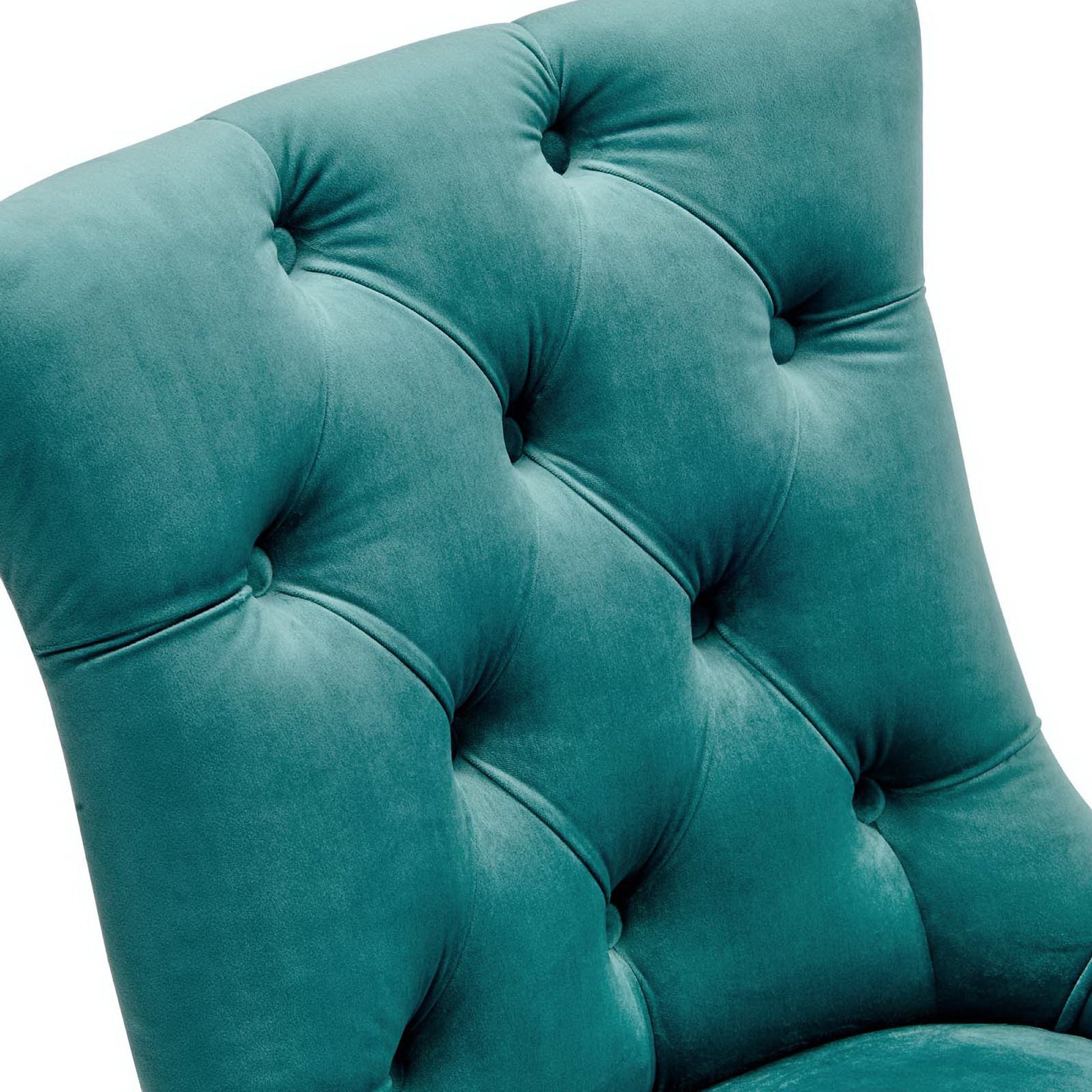 Blue tufted velvet dining side chairs, close-up showing deep button tufts and diamond-pattern quilting.