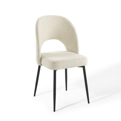 Beige fabric upholstered dining side chair with curved back, open arch, and black tapered legs.