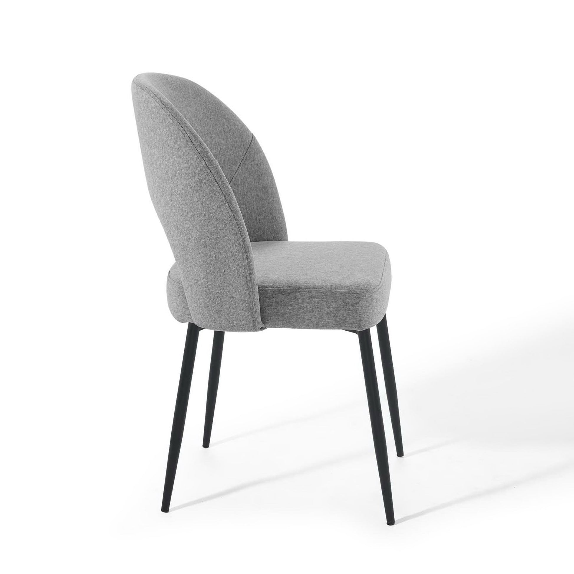 Grey fabric upholstered dining side chair with rounded back, curved arms, and slim black metal legs.