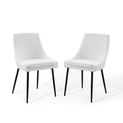 Set of 2 white upholstered dining chairs with curved backs and black tapered legs in a mid-century modern style.