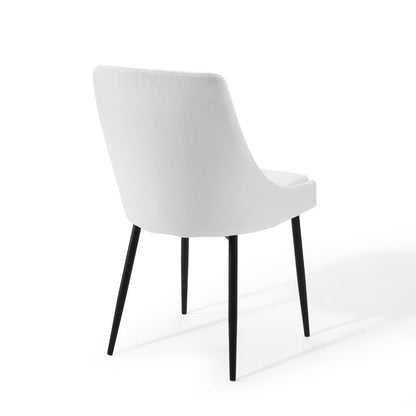 White upholstered dining chairs, set of 2, with curved backs and black tapered legs.