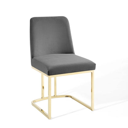 Gray upholstered dining chair with a gold-finish metal sled-base frame and squared back.
