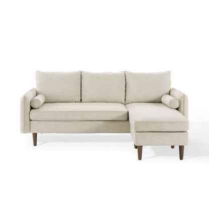 Brown fabric sectional sofa with chaise on one end, three back cushions and bolster pillows, tapered wooden legs