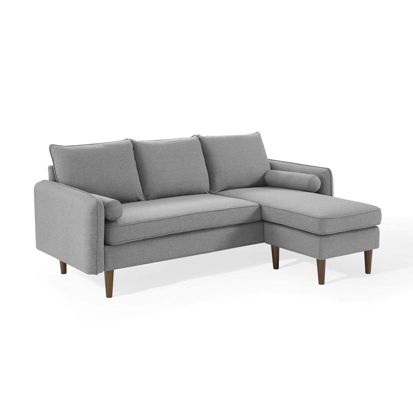 Light gray fabric sectional sofa in an L-shape with a right-side chaise, three back cushions, and wooden legs.