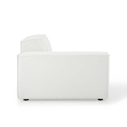 White fabric sofa with chaise extension on left, plush angled back cushion, clean modern lines.