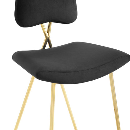 Black velvet counter stool with a curved seat and gold-tone metal legs.