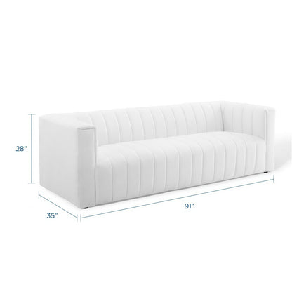 White fabric sofa with vertical channel tufting and squared arms, long rectangular silhouette; 91" long.