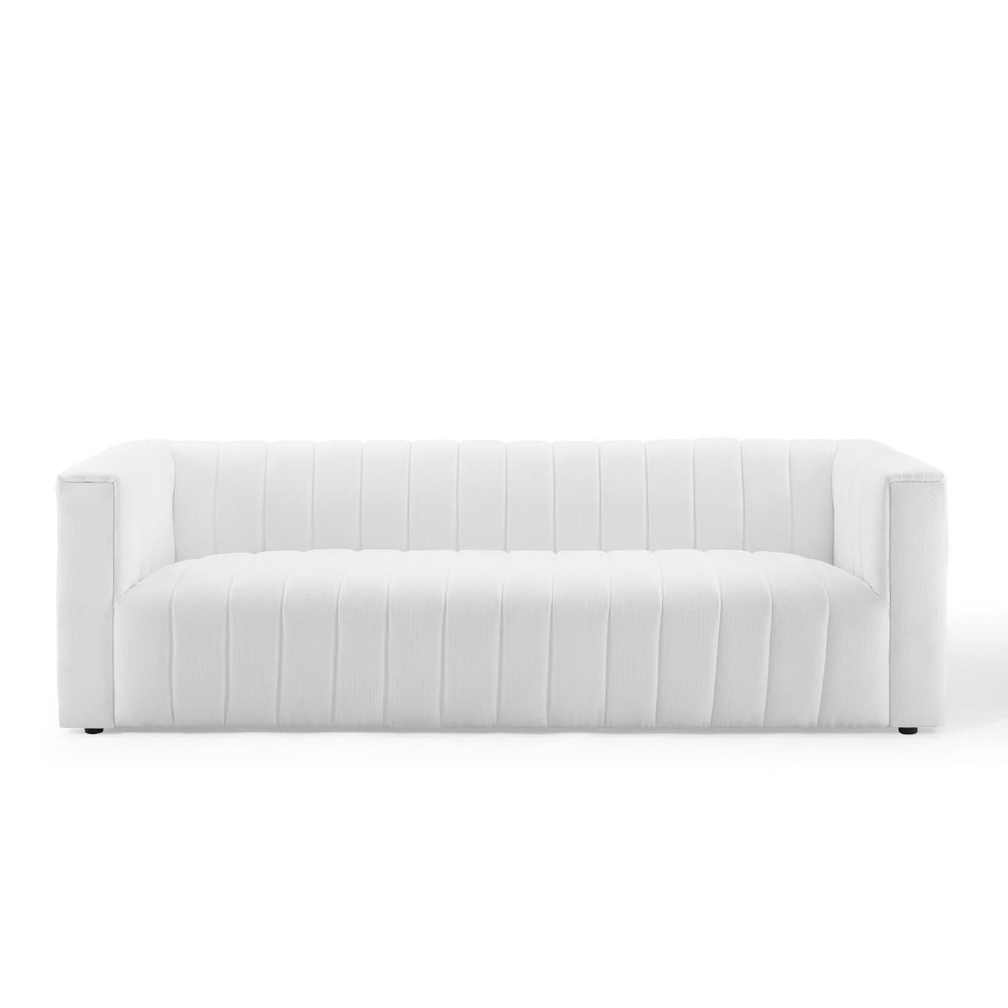 White upholstered sofa with vertical channel stitching, square arms, modern living room style.