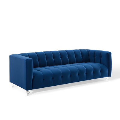Navy blue velvet tufted 3-seat sofa with square arms, button tufting and clear acrylic legs.