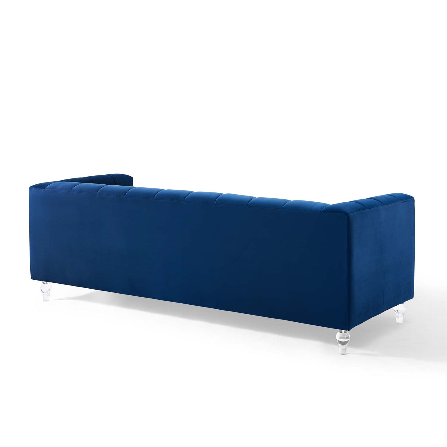 Navy blue velvet sofa with a low-profile silhouette, clean lines, and clear acrylic legs for modern living room seating.